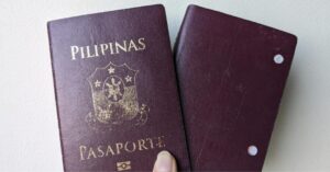a photo of two Philippines passport; the old one with punch holes and the new one - visa-free countries for filipinos
